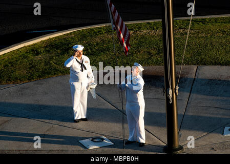 180101-N-QE566-001  PEARL HARBOR - (Jan. 1, 2018) (left to right) Culinary Specialist 2nd Class Gerado Taddei and Yeoman 2nd Class Andrew Thompson fly the 'First Navy Jack' to start the New Year on Joint Base Pearl Harbor-Hickam. Rear Adm. Brian Fort, commander, Navy Region Hawaii and Naval Surface Group Middle Pacific, directed the base headquarters building to fly the 'First Navy Jack' throughout 2018 to honor the 17 shipmates we lost on USS Fitzgerald (DDG-62) and USS John S. McCain (DDG-56)  and as a reminder that our warfighting edge is not only back but renewed and forged with purpose. ( Stock Photo