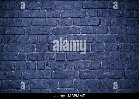 Grunge dark concrete background with imitation brickwork. Stock Photo