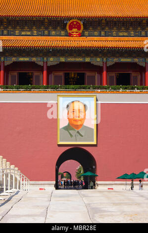 The entrance to the Forbidden City in Beijing, China, viewed across an ornamental bridge. Chairman Mao’s famous portrait hangs above the entrance gate Stock Photo