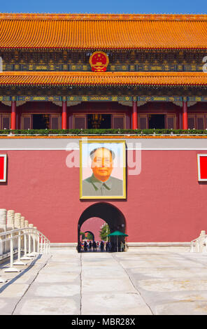 The entrance to the Forbidden City in Beijing, China, viewed across an ornamental bridge. Chairman Mao’s famous portrait hangs above the entrance gate Stock Photo