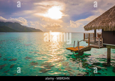 Overwater bungalow and lagoon at sunset. French Polynesia, Moorea. Stock Photo