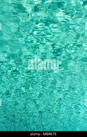 Close up abstract water texture. Turquoise swimming pool water background. Copy space, top view. Stock Photo