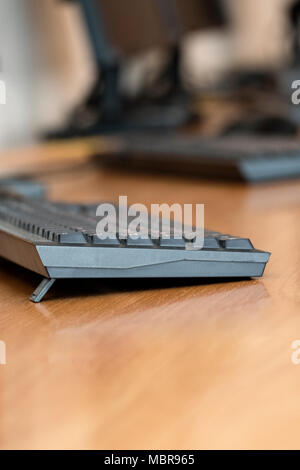 Image of computer keyboards on the table in line, shallow depth of field Stock Photo