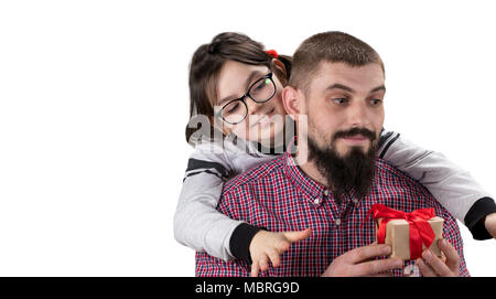 daughter making a gift to her father isolated on white background   with copy space. Concept of Father's Day. Stock Photo