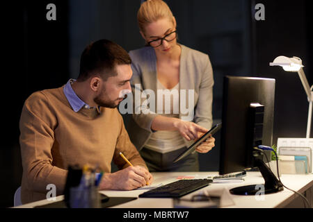 business team with tablet pc at night office Stock Photo