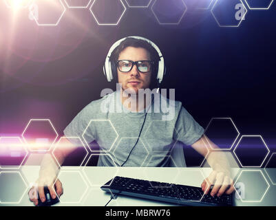 man in headset computer over hexagons projection Stock Photo