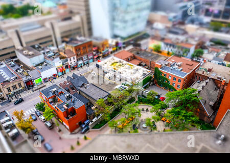 Interesting, diorama effect giving miniature details to the Toronto city centre, showing streets and the modern University building in the background.