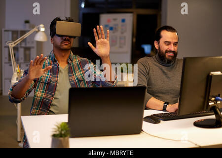 creative man in virtual reality headset at office Stock Photo