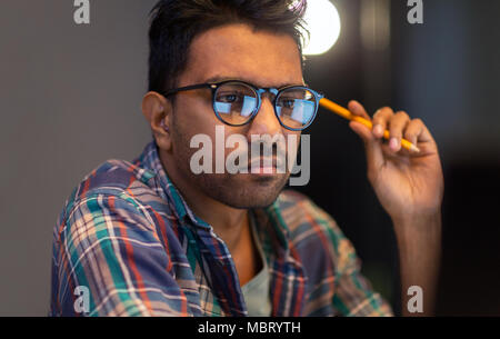 close up of creative man working at night office Stock Photo