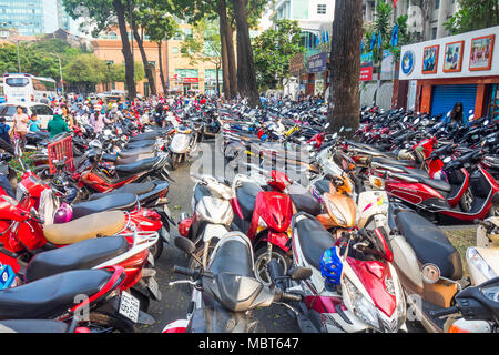 Motorcycles parked tightly in a parking lot in Ho Chi Minh City, Vietnam. Stock Photo