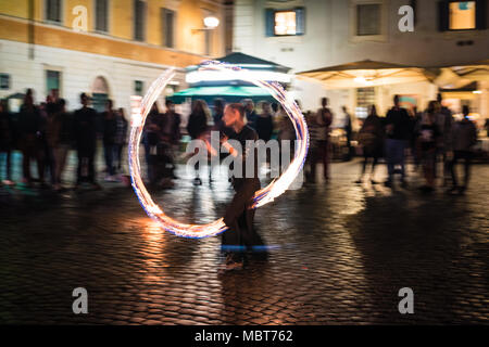 Female Fire Dancer, Street Performer in Trastevere, Rome, Italy Stock Photo