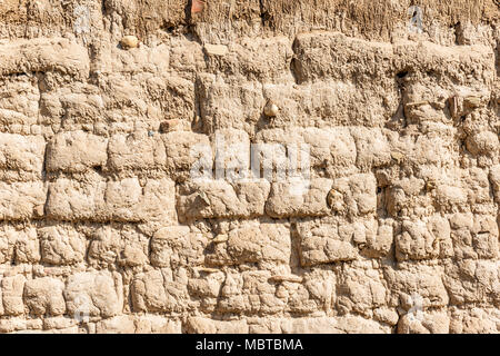 Old Andean adobe wall that occupies the whole picture and can be used as a background Stock Photo