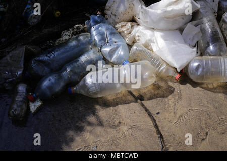 Heavy polluted water stream with domestic garbage Stock Photo - Alamy