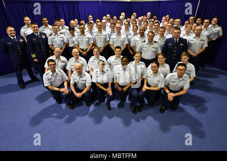 Coast Guard Cutter Mellon crewmembers pose for a group photo after the cutter’s 50th anniversary ceremony held in the Base Seattle gymnasium on Jan. 9, 2018. Named after Andrew W. Mellon, the 49th Secretary of Treasury from 1921-1932, the Mellon’s keel was laid on July 25, 1966 was she was commissioned on January 9, 1968. U.S. Coast Guard photo by Petty Officer 2nd Class Ali Flockerzi. Stock Photo