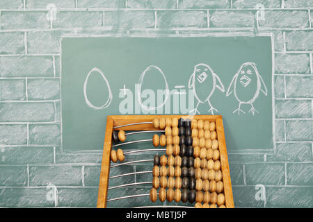 Education funny idea about mathematics on sample of addition of eggs Stock Photo