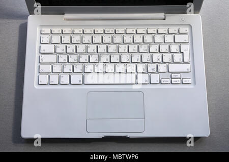 laptop keyboard fragment of the laptop lying on the table Stock Photo