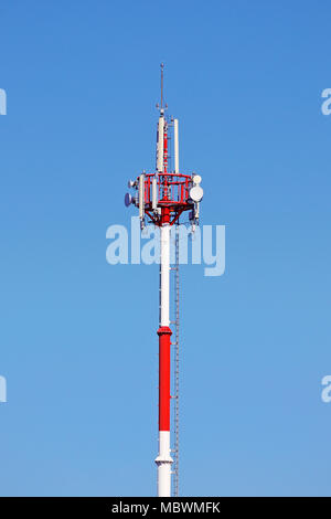 Communication Tower against a blue sky Stock Photo