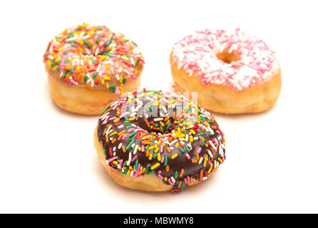 Various Flavored Sprinkle Donuts on a White Background Stock Photo