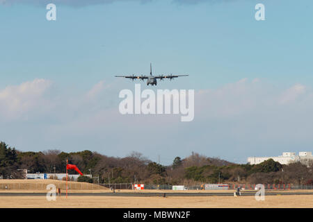 A C-130J Super Hercules approaches the runway at Yokota Air Base, Japan, Jan 10, 2018. Yokota has received its tenth C-130J from Dyess Air Force Base, Texas, as part of fleet-wide redistribution of assets set in motion by Air Mobility Command. (U.S. Air Force photo by Yasuo Osakabe) Stock Photo