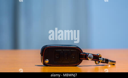 Remote car keys and leather case isolated Stock Photo