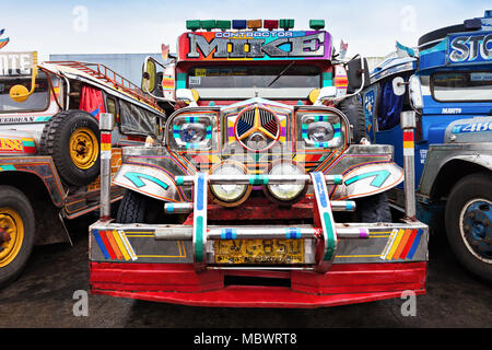 MANILA, PHILIPPINES - FEBRUARY 25: Jeepney on the bus station on February, 25, 2013, Manila, Philippines. Jeepney is a most popular public transport o Stock Photo