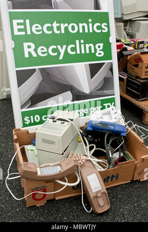 An "Electronics Recycling" sign tells people where to drop off old phones, etc. at a recycling event on November 23, 2013 in Lawrenceville, GA. Stock Photo
