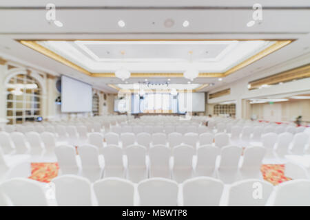 Blurred, defocused background of modern conference room. Company business meeting, convention center, financial economic forum, or organization event Stock Photo