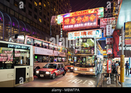 HONG KONG - MARCH 19: Buses on the street on March 19, 2013 in Hong Kong. Over 90%  travelers in HK use public transport. Its the highest rank in the  Stock Photo