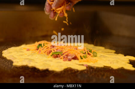 A ham and cheese omelet is prepared for a customer during the breakfast rush inside the Raider Café at Ellsworth Air Force Base, S.D., Jan. 12, 2018. Having won the Hennessey award several times in the past, an award recognizing the best dining facilities in the Air Force, food service personnel of the 28th FSS gear up to compete in this year’s competition. (U.S. Air Force photo by Airman 1st Class Donald C. Knechtel) Stock Photo