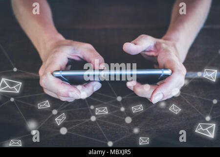 writing email on mobile phone -  typing mail on smartphone Stock Photo