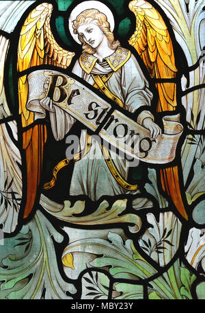 Stained glass window depicting an angel and a positive message with the words 'Be strong'. Taken at the church in the abandoned village of Tyneham, Dorset, U.K. Stock Photo