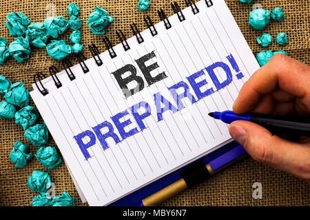 Word writing text Be Prepared Motivational Call. Business concept for Stay Ready Willing to take an opportunity written by Man Holding Marker Notebook Stock Photo