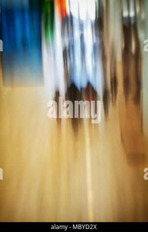 Abstract image of people entering building and walking in lobby of building Stock Photo