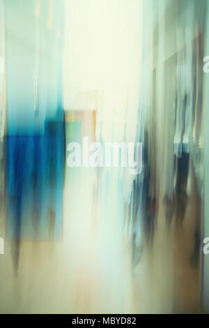 Abstract image of people walking  in building lobby Stock Photo