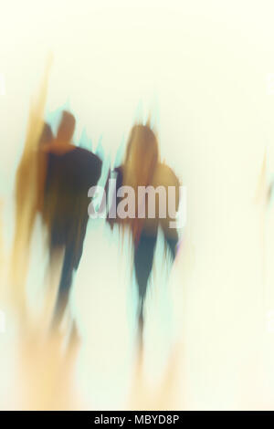 Abstract image of couple walking toward the light Stock Photo