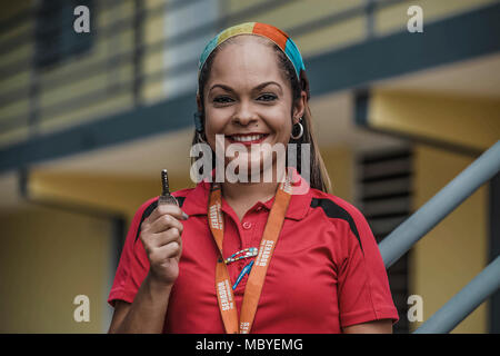 BAYAMÓN, Puerto Rico, Dec. 21, 2017--A survivor happily displays the key of her new temporary home. The FEMA Direct Lease Program provides temporary housing to survivors when rental resources are unavailable. Under this program all utilities expenses are included in the rent and covered by FEMA. Eduardo Martínez/FEMA Stock Photo