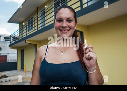 BAYAMÓN, Puerto Rico, Dec. 21, 2017--A survivor happily displays the key to her new temporary home in Bayamón.  The FEMA Direct Lease Program provides temporary housing to survivors when rental resources are unavailable. Under this program all utility expenses are included in the rent and covered by FEMA. Eduardo Martínez/FEMA Stock Photo