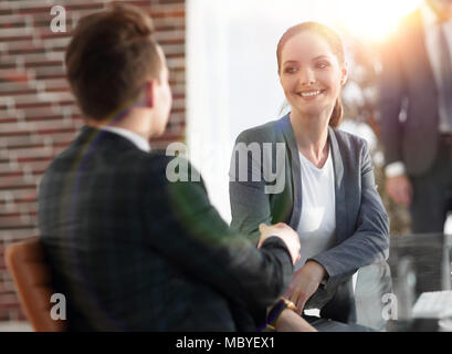 handshake Manager and the client in the office Stock Photo