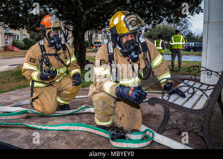 Maxwell AFB, Ala. – Fire and Emergency Services personnel simulate responding to a mass casualty situation during the base Major Accident Response exercise, Feb. 12, 2018. (Air Force Stock Photo