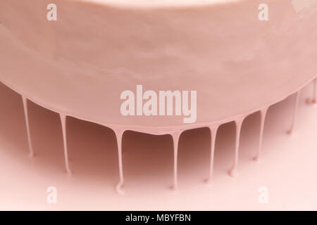 Process of pouring pink glaze on mousse cake, homemade food Stock Photo