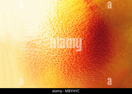 Texture of fresh bright orange peel, closeup, copy space. Macro of orange fruit. Citrus fruit background Stock Photo
