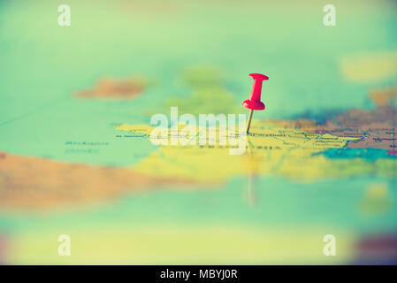 Red pushpin, thumbtack, pin showing the location, travel destination point on map. Copy space, lifestyle concept Stock Photo