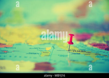 Red pushpin, thumbtack, pin showing the location, travel destination point on map. Copy space, lifestyle concept Stock Photo