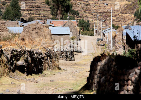 Dirt Road through a small, typical village in the Peruvian Andes Stock Photo