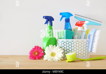 Spring cleaning office or house concept. Different cleaning supplies over  blurred spring background among floating soap bubbles. Copy space Stock  Photo - Alamy