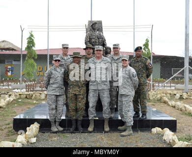 The leadership team of the 346th Air Expeditionary Group and leaders of the Panamanian military and police force known as SENAFRONT, stand for a photo during Exercise New Horizons 2018 April 1, 2018 in Meteti, Panama. Exercise New Horizons is a joint training exercise where all branches of the U.S. military conduct training in civil engineer, medical and support services while benefiting the local community. Stock Photo