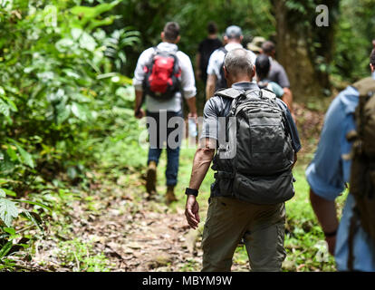 Members of the 346th Air Expeditionary Group hike along a trail in the Darien National Park, Panama, April 2, 2018, during exercise New Horizons 2018. At the end of the hike, the exercise participants spoke with rural village members about the benefits that New Horizons 2018 would bring to their community, including medical assistance and facilities such as schools, a youth community center and a women’s health ward. Exercise New Horizons is a joint training exercise where all branches of the U.S. military conduct training in civil engineer, medical and support services while benefiting the lo Stock Photo