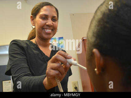 JACKSONVILLE, Fla. (April 2, 2018) Janet Walker, a certified medical assistant at Naval Branch Health Clinic Jacksonville’s deployment health center, takes a sailor’s vitals as part of a deployment pre-screening. Deployment health includes activities before, during, and after deployments. Walker, a native of Fort Walton Beach, Florida, takes pride in getting service members ready for deployment. “We want this to be a seamless process that screens, identifies, and treats service members efficiently and effectively. We take care of the active duty and make sure they are deployable.” Stock Photo