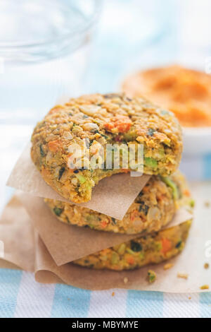 Vegan vegetable cookies. Carrot & pumpkin  seed veggie bites with carrot & cannelloni bean houmous Stock Photo