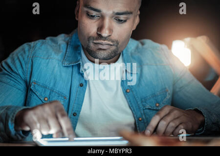 Earnest IT guy testing speed Stock Photo